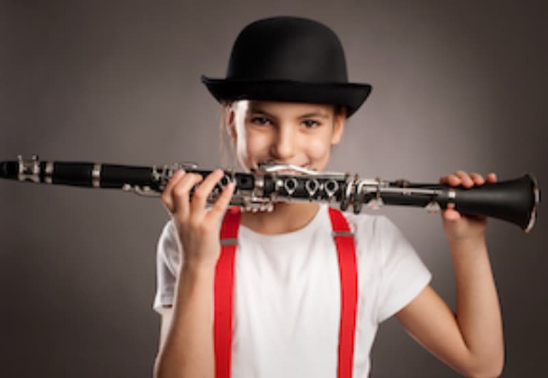 Clarinet lessons in Brighton MI student holding clarinet at Brighton Music Academy